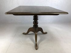 Square tilt-top table on tripod pedestal, approx 98cm x 84cm x 73cm tall