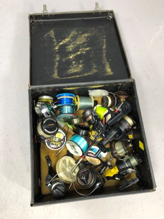 Box containing sea fishing reels etc to include fix spool reel by maker Penn