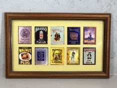 Framed collection of miniature vintage enamel advertising signs, each approx 8cm x 6cm, to include