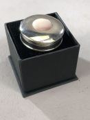Silver hallmarked round pill box with mother of Pearl setting to lid