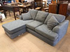 Modern grey fabric two seater sofa with footstool, length approx. 214cm and depth at the footstool