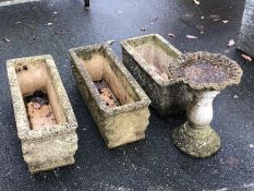 Three concrete garden troughs and a small garden bird bath