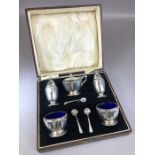 Silver hallmarked Cruet set comprising two salts with with blue glass liners, one Mustard with