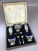 Silver hallmarked Cruet set comprising two salts with with blue glass liners, one Mustard with