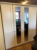 Modern triple wardrobe, white painted, with two full length mirrors, hanging rail and shelf space,