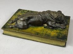 Paper weight depicting a Bulldog lying on a book!