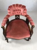 Upholstered and carved bedroom chair on original castors