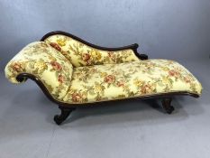 Chaise longue on ceramic castors with scroll detailing and upholstered in rose print fabric