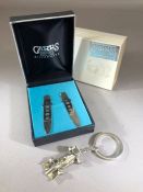 Hallmarked Silver pair of boxed collar Stiffeners and a silver coloured key chain F1 car