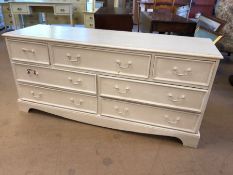 White painted low chest of seven drawers, approx 154cm x 46cm x 72cm