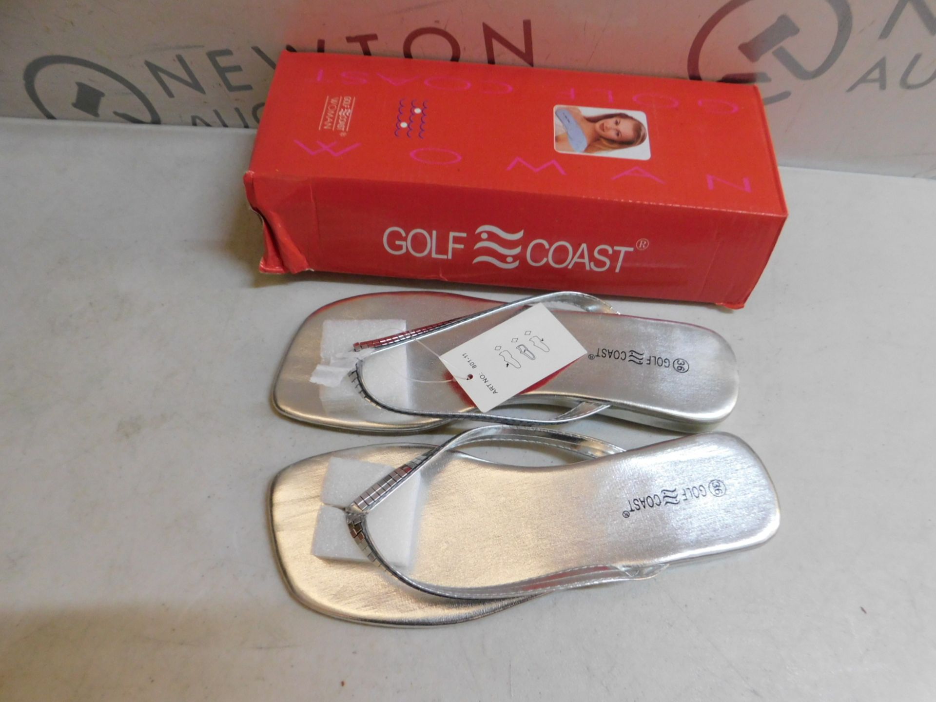 1 BOXED PAIR OF WOMEN FLIPFLOPS SILVER SIZE 36