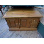 Low polished pine rectangular storage box fitted double cupboard and 2 small drawers