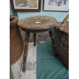 Decorative circular dished stool, he dish seat with raised carved floral splays