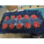 Fine hessian backed rag rug in black, grey inset design of red poppies