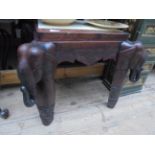 Most interesting carved side table with elephant masks to the 4 corners