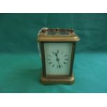 Brass carriage clock, the enamel dial inset roman numerals