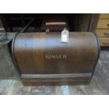 Singer sewing machine in domed oak case