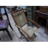 Edwardian mahogany framed adjustable foot stool with original gilt and green floral brocade