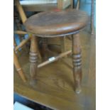 Low oak stool with splayed turned feet united by cross stretchers