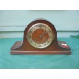 CLOCKS Steel dialed mantelclock in shaped domed carved oak case