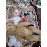 Wicker basket containing a sel. of miniature and larger dolls, teddy bear etc.