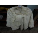 Lined white fur ladies cape with front tie (size small/medium)