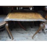 Modern carved walnut side table with pie crust edging and glass top