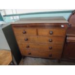 Oak chest of 2 short and 3 long drawers in mixed woods each with bobbin handles on bracket feet