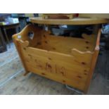 Polished pine child's crib on rockers