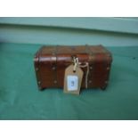 Small brass bound oak casket box containing miniature doll,