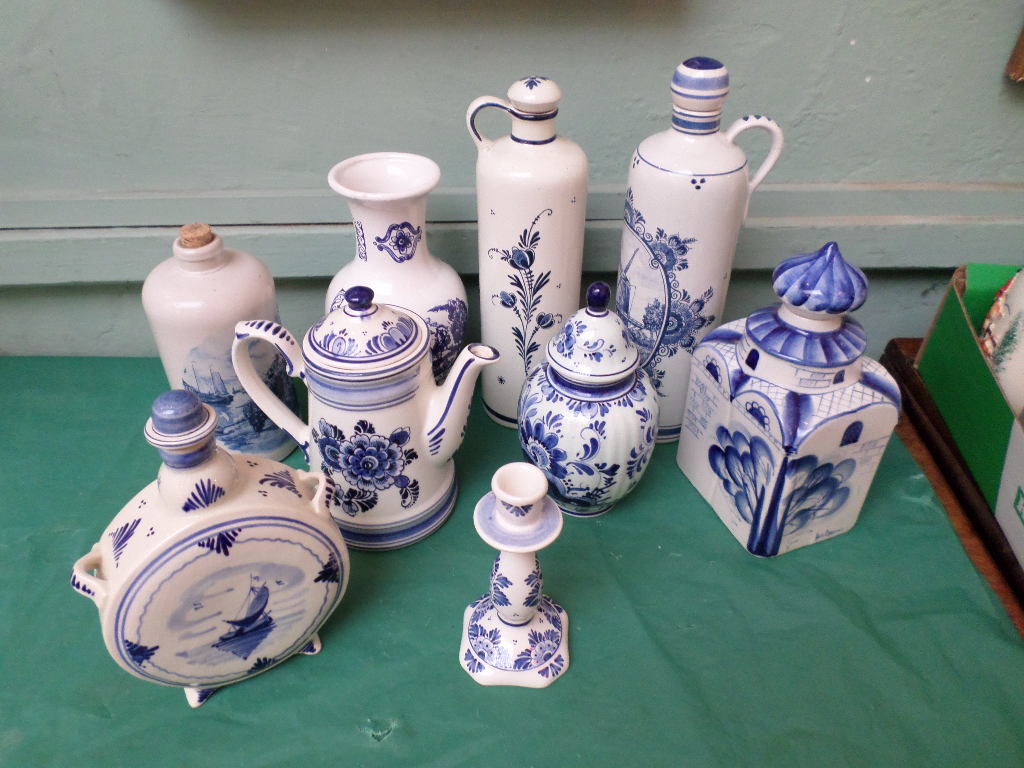 9 larger blue and white Delft items incl. canister, drum and cylindrical flasks etc.