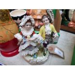 Hand painted wooden Russian Doll set together with a European figure of bride and groom on