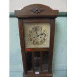Oak cased wall clock with steel dial and brass pendulum