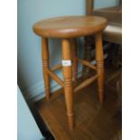 Light oak stool with circular dish seat