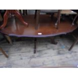 Low large oval coffee table on 4 shaped feet