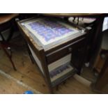 2 tier side table the glass top of each with mauve floral pattern inset,