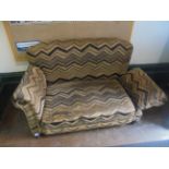 Edwardian 2 seater drop arm settee on castors re-upholstered in striped brown and black moquette