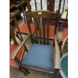 Oak framed armchair with four vertical splats to back,