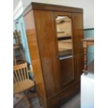 Inlaid mahogany wardrobe inset bevel edged rectangular mirror,