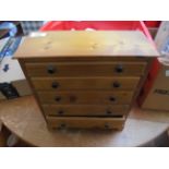 Small polished pine set of 5 graduated storage drawers
