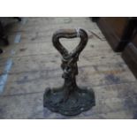 Antique iron doorstop on splayed plinth