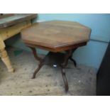 Mahogany octagonal topped side table with undershelf on 4 splayed feet on pot castors