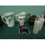 Magpie lot including ceramic Scotty dog ornament, 3 decorative jugs and a pair of stone bottles,