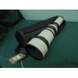 Telescope with adjustable lense in black canvas carrying case