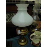 Brass oil lamp with clouded glass shade