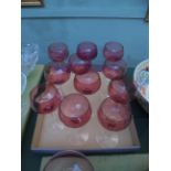 Selection of 11 cranberry glass stemmed wine glasses