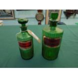 2 green glass chemist bottles each with label and stopper