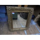 Rectangular wall mirror in ornate gilt frame