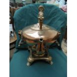 Ornate copper kettle on stand