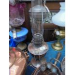 Silver plated oil lamp with shaped glass flue